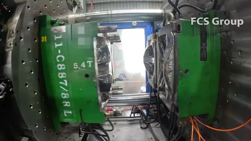 Injection molding of two-color tail light